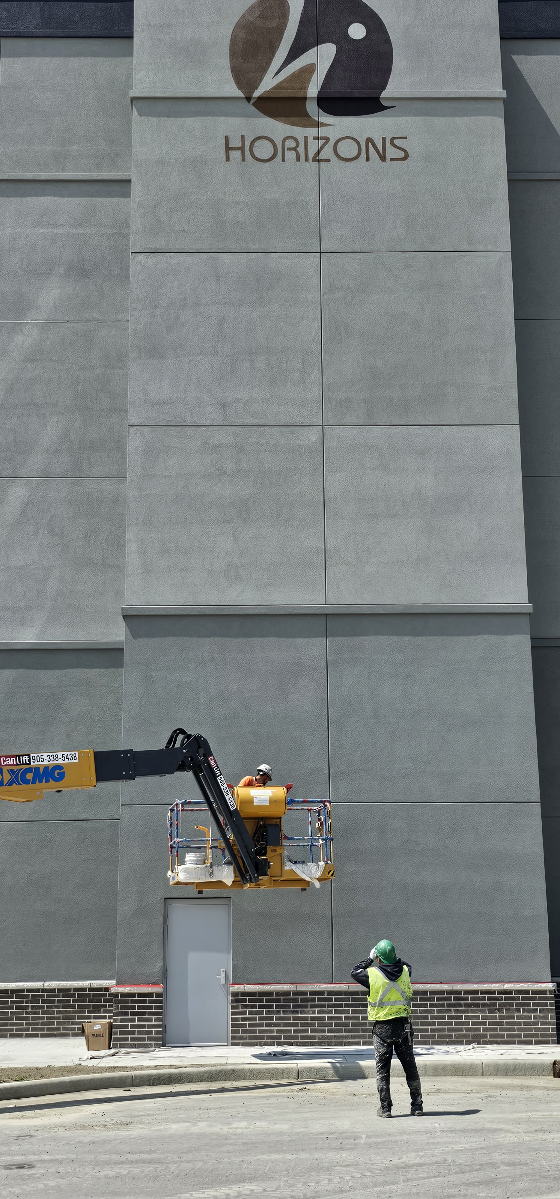 Exterior Logo Painting — Boom Lift
